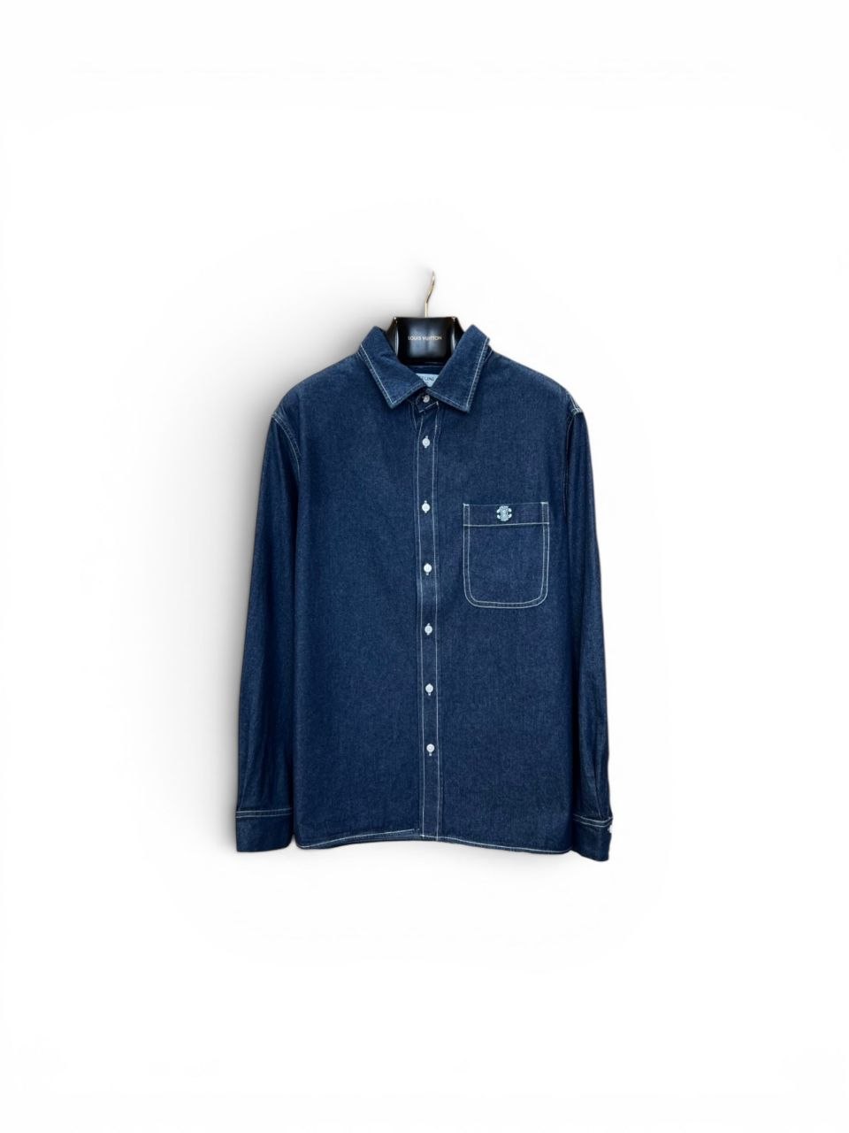 Close-up of Celine Triomphe logo embroidery on denim pocket