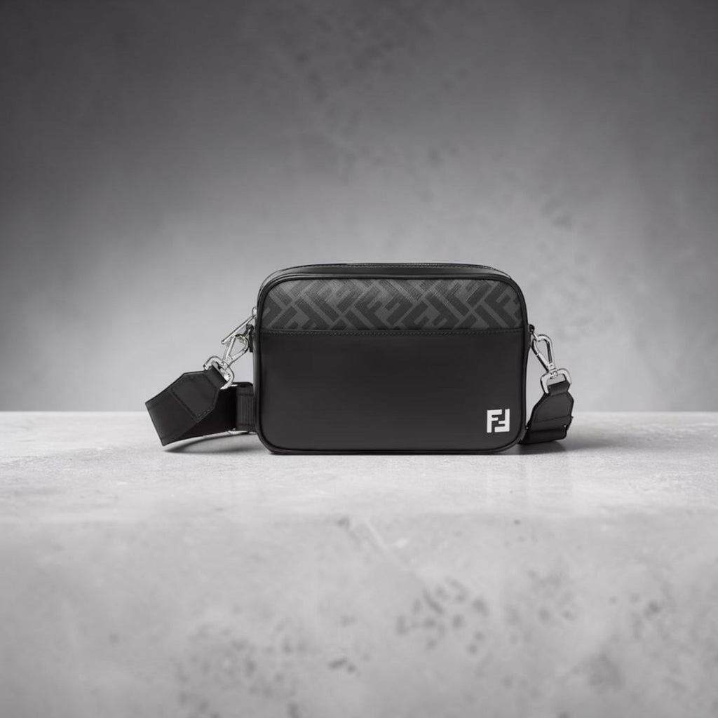 Model wearing Fendi black leather camera bag with FF motif panel.
