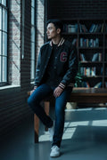 Celine black wool and leather Teddy varsity jacket with red and white striped trim.
