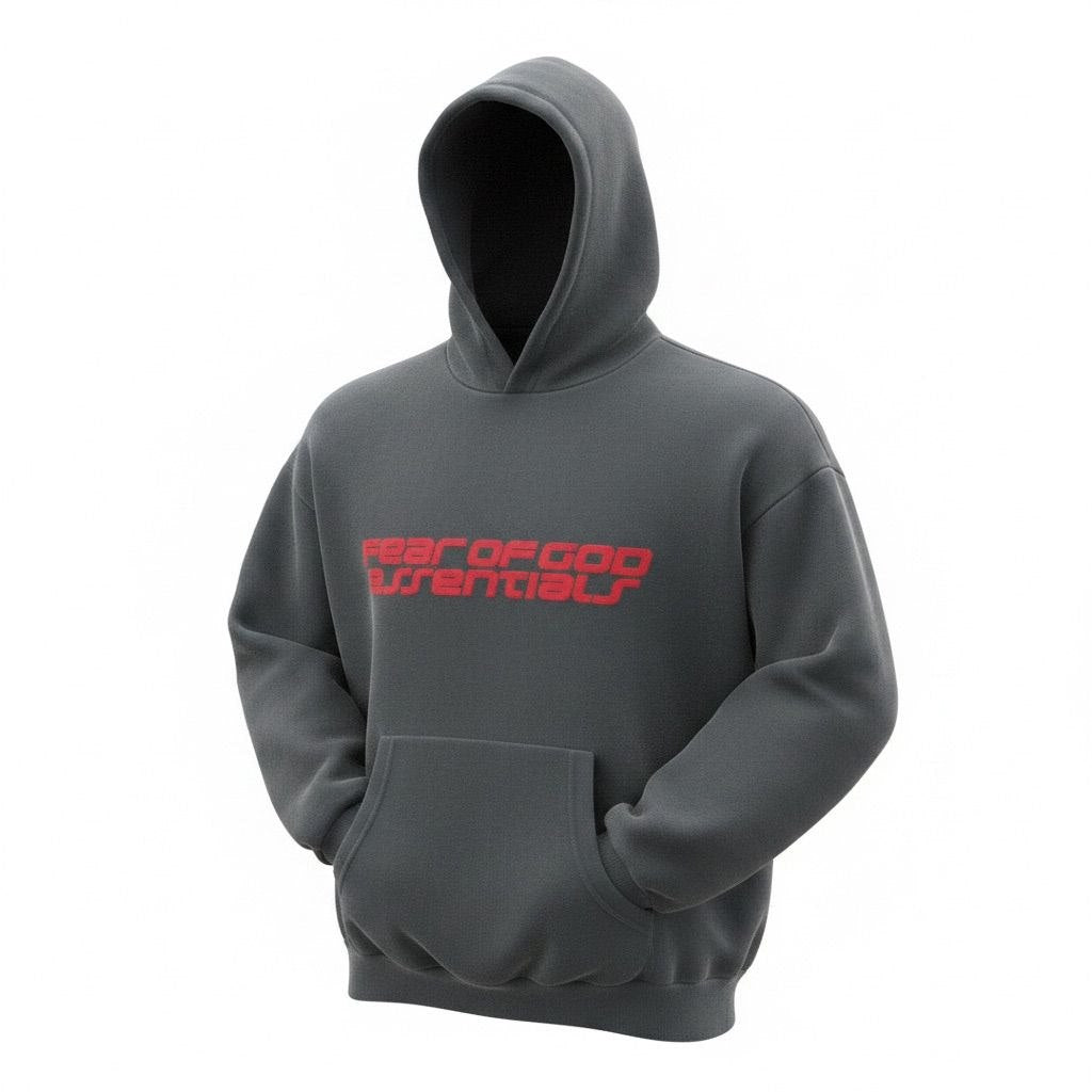 Model wearing a grey Fear of God Essentials cable fleece hoodie with bold red lettering.