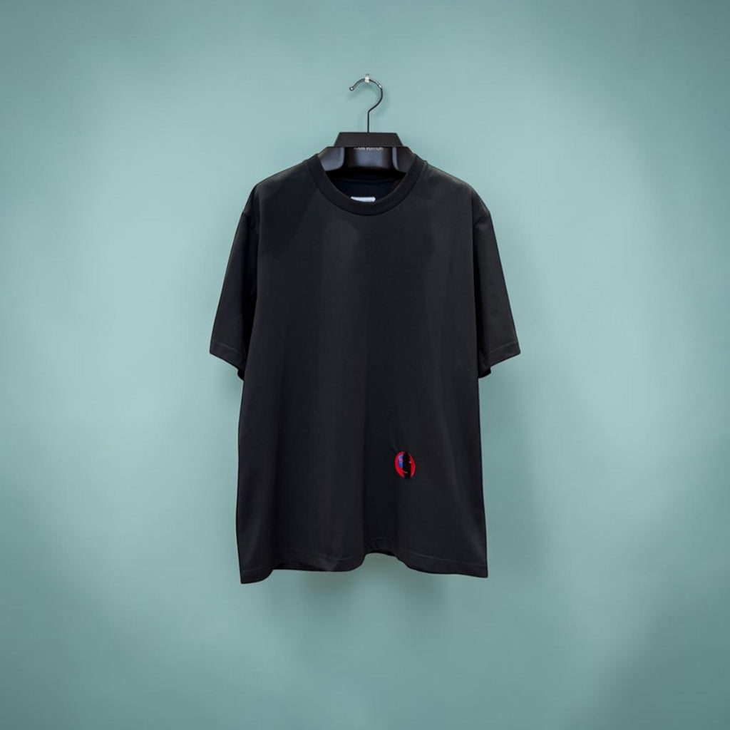 Black Bottega Veneta t-shirt with small red and blue abstract face embroidery.
