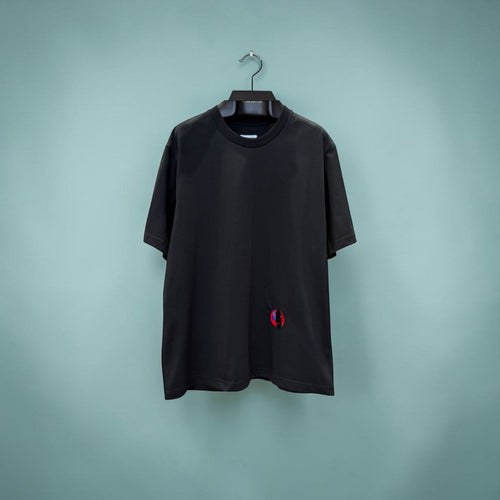 Black Bottega Veneta t-shirt with small red and blue abstract face embroidery.