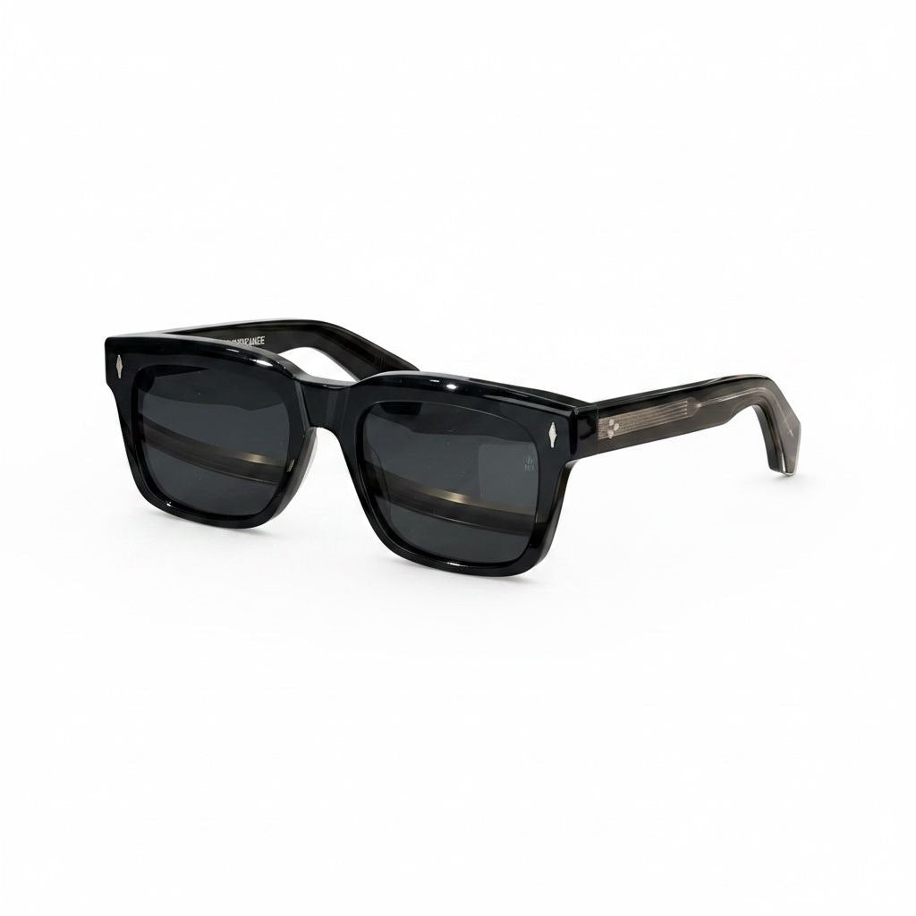 Front view of bold 10mm black acetate frames by Jacques Marie Mage with signature arrowhead pins.