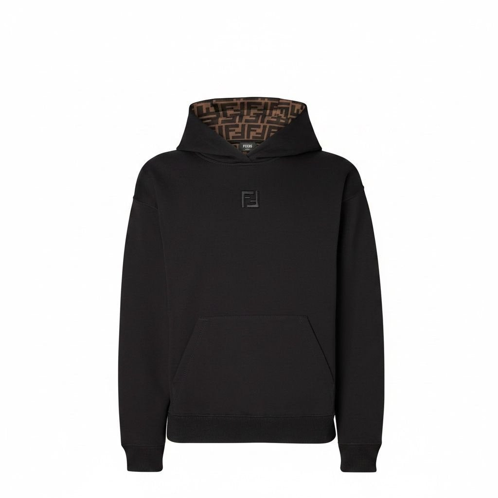 Model wearing a black Fendi hoodie featuring the brown FF monogram inside the hood.