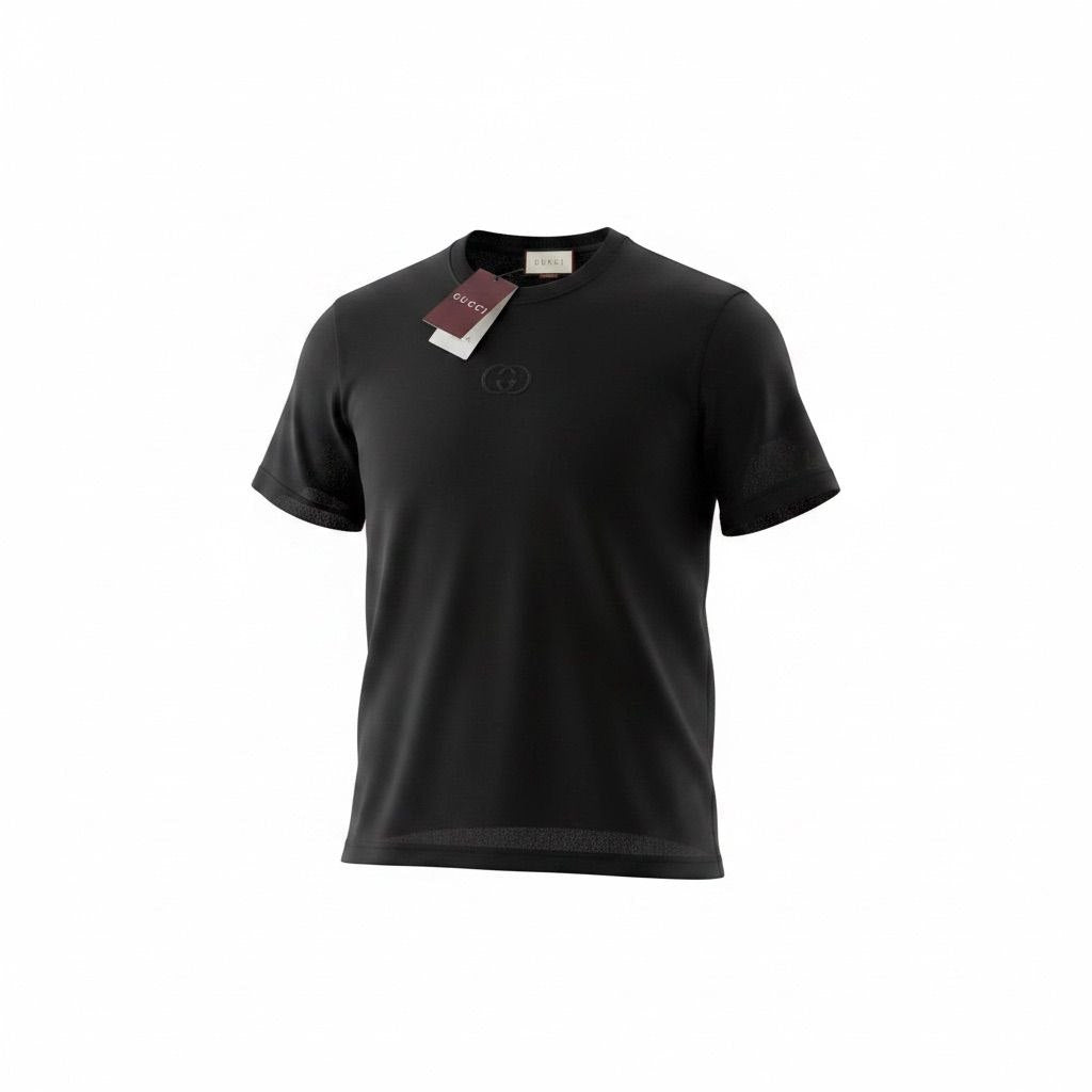 Model standing in a garden wearing a black Gucci t-shirt with a tonal Interlocking G logo on the chest.