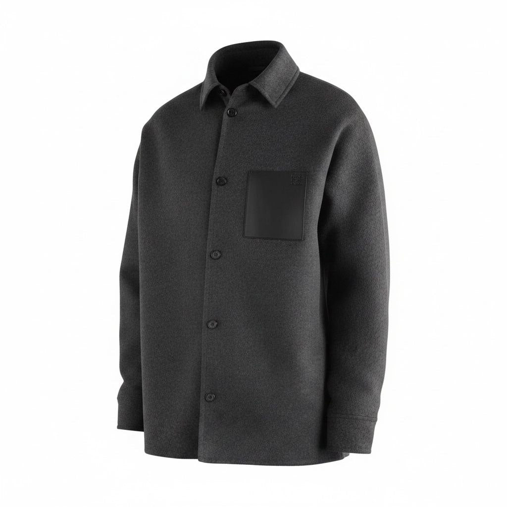 Detailed view of the LOEWE debossed Anagram on a black leather pocket against charcoal wool."
