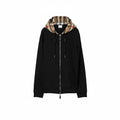 Front view of a black Burberry zip-up hoodie with the iconic tan archive check pattern lining the interior of the hood.