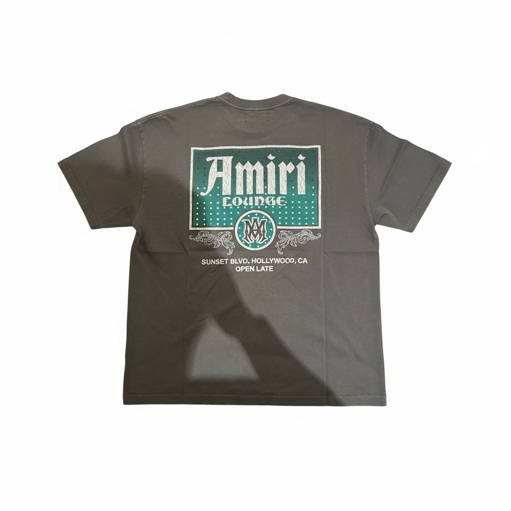 Back view of an AMIRI Lounge t-shirt featuring a large green Sunset Blvd Hollywood CA open late graphic.